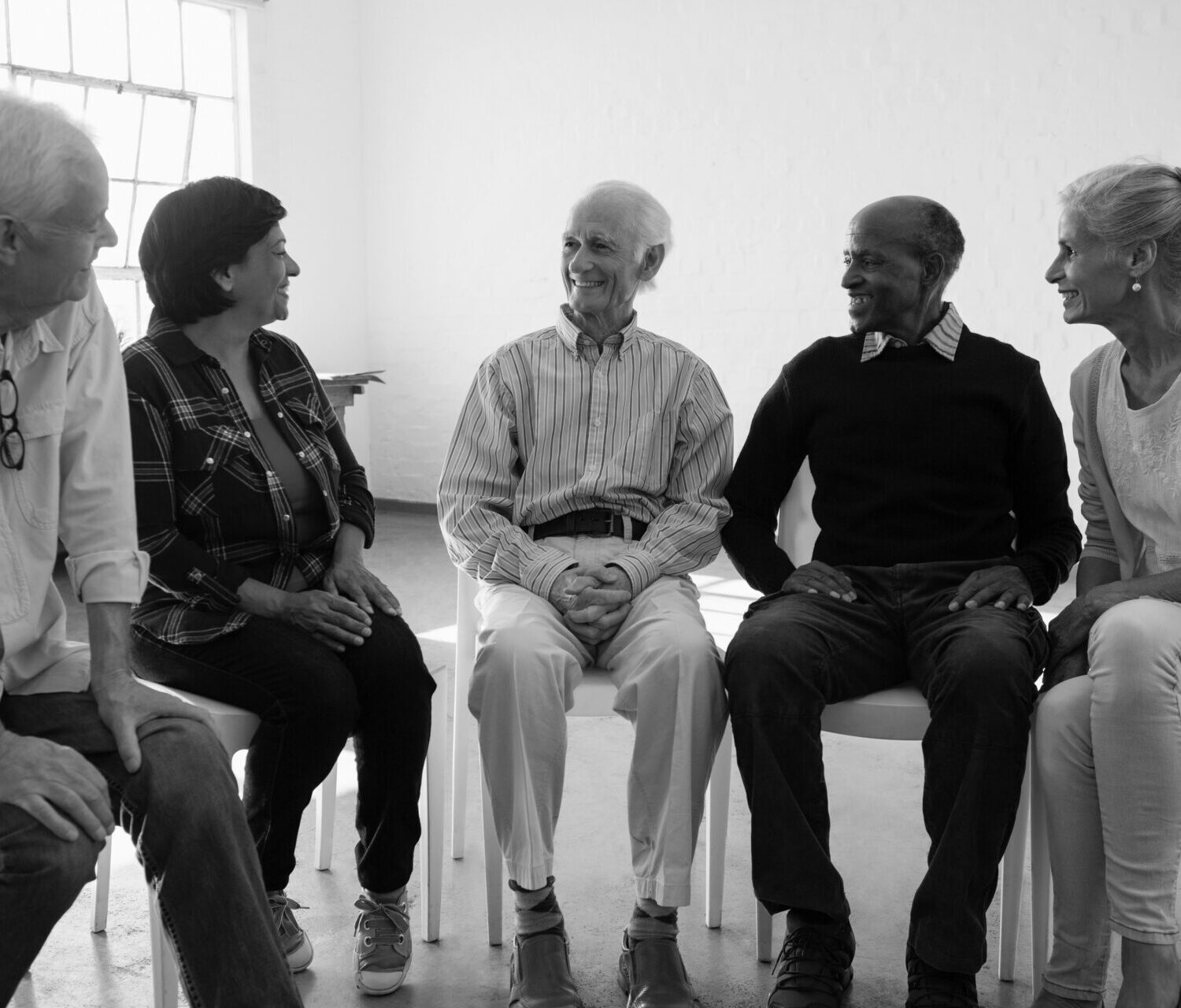 Friends talking during discussion in art class